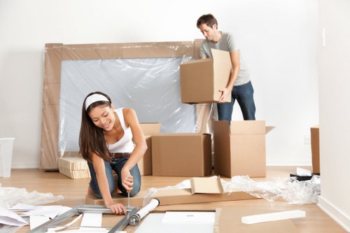 Team handling moving boxes safely during a removals operation