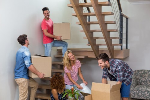 Removal team planning a local move in a German city apartment area