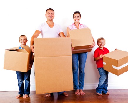Van removals team loading boxes for a local move in Germany