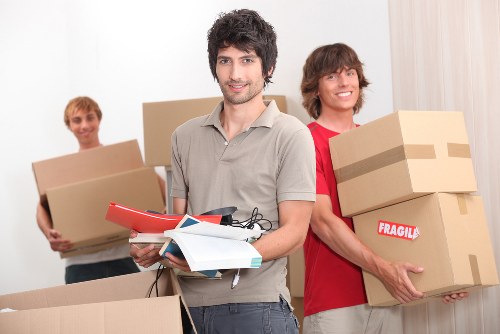 Local van service helping with furniture and boxes during a move