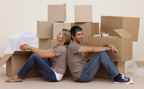 Packed household boxes and furniture ready for transport