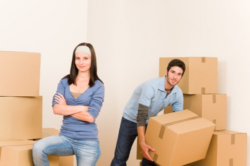 Local packing team working in an apartment building with stair access