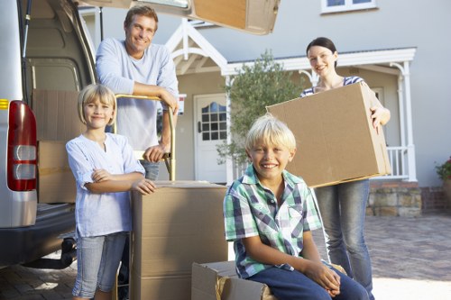 Professional movers preparing fragile items for transport in Germany