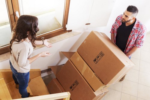 Residential moving team handling boxes and furniture in Germany