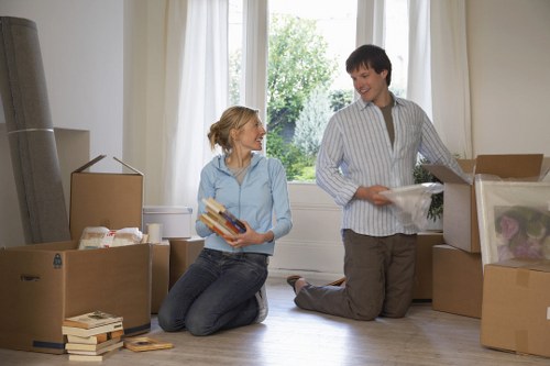 Boxes and furniture being loaded into a van for a local move