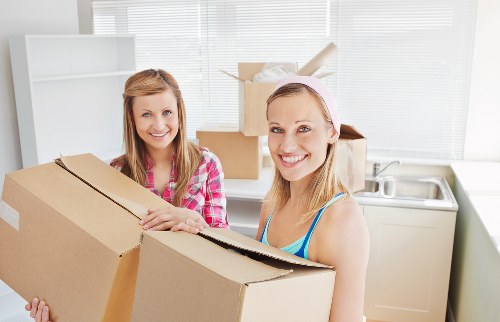 Apartment move preparation with labeled boxes and packed items