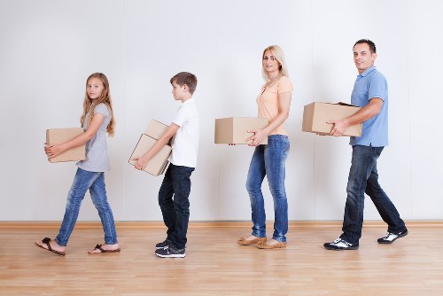Professional movers loading items for a local removal service in Germany