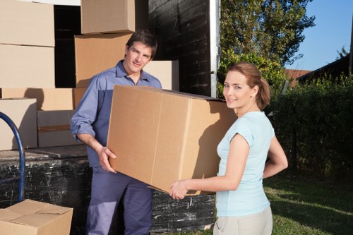 Local movers loading household items with careful access planning